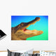 Alligator head with open mouth against a blue and green background Wall Mural