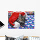 Grey tabby cat with santa claus hat lying Wall Mural