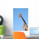 A giraffe against a blue sky;Africa Wall Mural