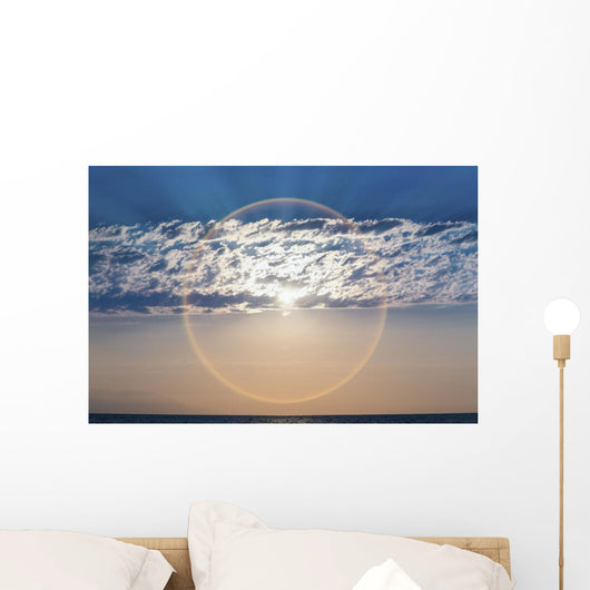The setting sun creates a sundog;Puerta vallarta mexico Wall Mural