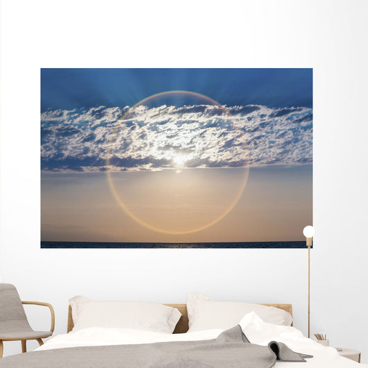 The setting sun creates a sundog;Puerta vallarta mexico Wall Mural