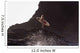 Distant View Of Female Surfer With Surfboard Standing On Rock Wall Mural
