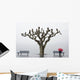 A tree and a person with a red umbrella Wall Mural