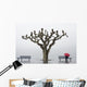 A tree and a person with a red umbrella Wall Mural