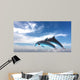 Couple  Of Dolphins Jumping Against The Blue Sky Wall Mural