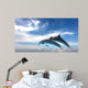 Couple  Of Dolphins Jumping Against The Blue Sky Wall Mural