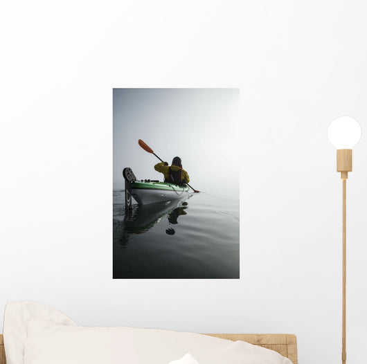 A Sea Kayaker Paddles Into Thick Fog On On A Calm Morning Wall Mural