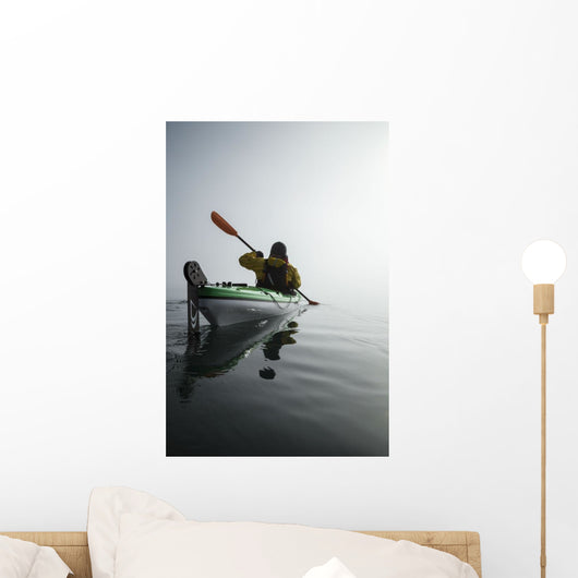 A Sea Kayaker Paddles Into Thick Fog On On A Calm Morning Wall Mural