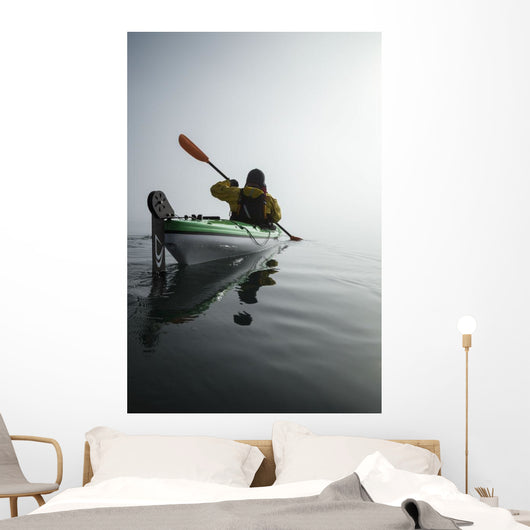 A Sea Kayaker Paddles Into Thick Fog On On A Calm Morning Wall Mural