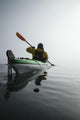 A Sea Kayaker Paddles Into Thick Fog On On A Calm Morning Wall Mural