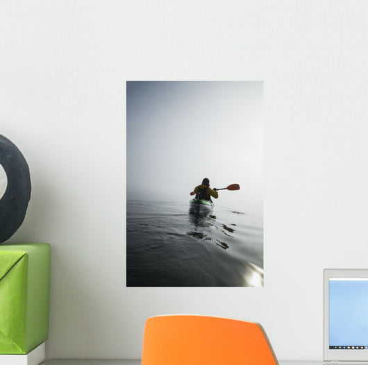 A Sea Kayaker Paddles Into Thick Fog On On A Calm Morning Wall Mural