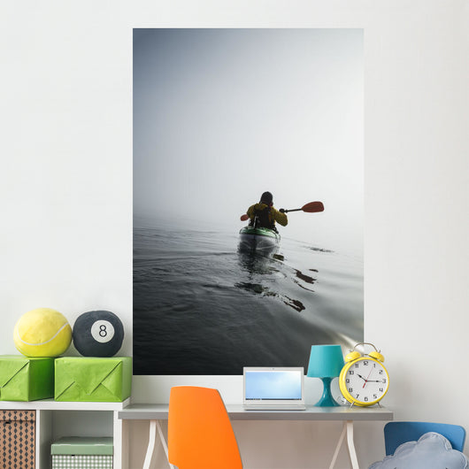 A Sea Kayaker Paddles Into Thick Fog On On A Calm Morning Wall Mural