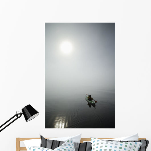 A Sea Kayaker Paddles Into Thick Fog On On A Calm Morning Wall Mural