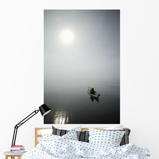 A Sea Kayaker Paddles Into Thick Fog On On A Calm Morning Wall Mural