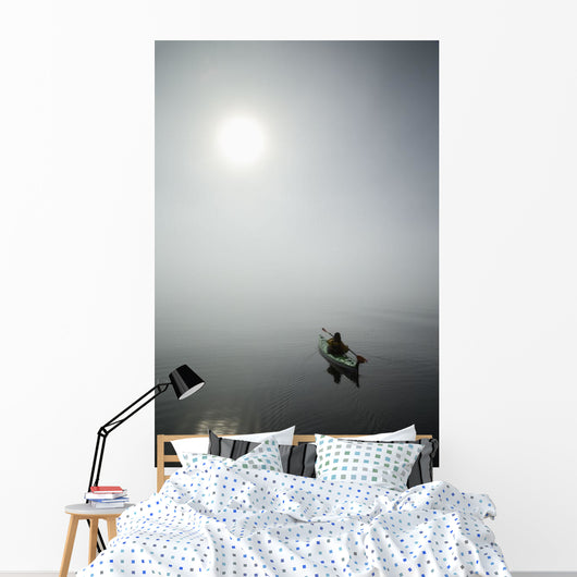 A Sea Kayaker Paddles Into Thick Fog On On A Calm Morning Wall Mural