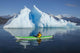 A Sea Kayaker Paddles Beside An Iceberg Wall Mural