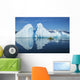 A Sea Kayaker Paddles Beside An Iceberg Wall Mural