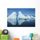 A Sea Kayaker Paddles Beside An Iceberg Wall Mural
