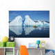 A Sea Kayaker Paddles Beside An Iceberg Wall Mural