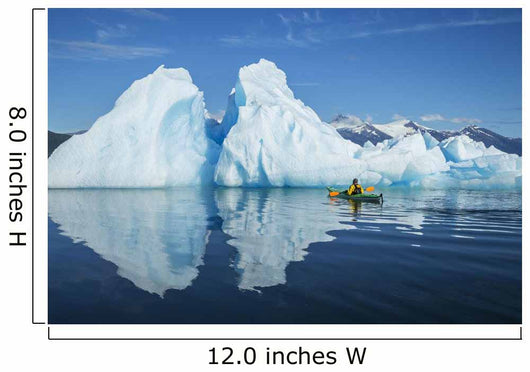 A Sea Kayaker Paddles Beside An Iceberg Wall Mural
