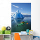 A Sea Kayaker Paddles Beside An Iceberg Wall Mural