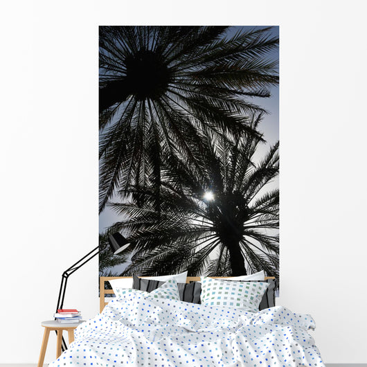 Silhouette Of Date Palm Trees In Oasis Wall Mural