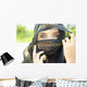 A Woman's Eyes Peering Out From A Headscarf Wall Mural