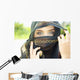 A Woman's Eyes Peering Out From A Headscarf Wall Mural