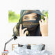 A Woman's Eyes Peering Out From A Headscarf Wall Mural