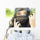 A Woman's Eyes Peering Out From A Headscarf Wall Mural