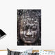 A face sculpture on a stone wall at angkor wat;Cambodia Wall Mural