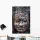 A face sculpture on a stone wall at angkor wat;Cambodia Wall Mural