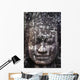 A face sculpture on a stone wall at angkor wat;Cambodia Wall Mural