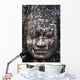A face sculpture on a stone wall at angkor wat;Cambodia Wall Mural