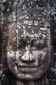 A face sculpture on a stone wall at angkor wat;Cambodia Wall Mural