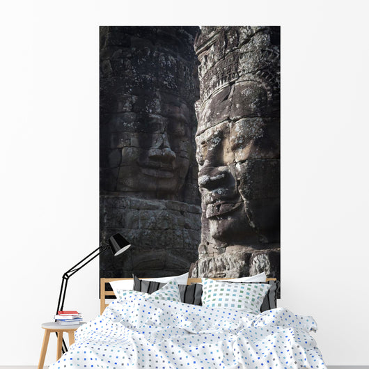 Face sculptures on stone walls at angkor wat;Cambodia Wall Mural