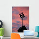 Silhouette of a cross on church steeple with fiery cloud cover Wall Mural