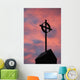 Silhouette of a cross on church steeple with fiery cloud cover Wall Mural