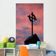 Silhouette of a cross on church steeple with fiery cloud cover Wall Mural