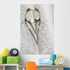Close up of a gold ring with the shadow of an heart Wall Mural