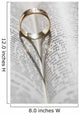 Close up of a gold ring with the shadow of an heart Wall Mural