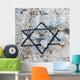 A star of david etched and painted on a rock with stones laying on it Wall Mural