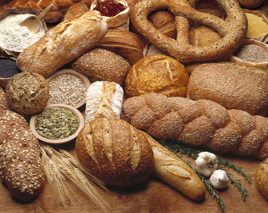 Food - Various types of breads and some of their ingredients Wall Mural