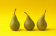 Three Pears on Yellow Background Wall Mural