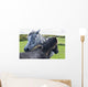 Horses on a lush green field Wall Mural