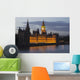 A Building And Clock Tower Along The Water's Edge Illuminated At Dusk Wall Mural