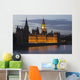 A Building And Clock Tower Along The Water's Edge Illuminated At Dusk Wall Mural