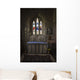Stained glass windows and a table surrounded with candles in a church Wall Mural