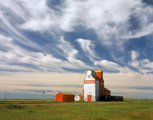 Inland grain terminal with railway in the prairies Wall Mural