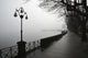Lamp post and trees on a promenade along Lake Maggiore Wall Mural